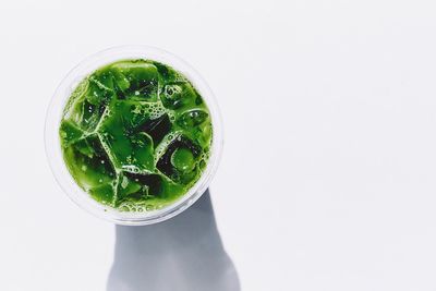 Close-up of drink against white background
