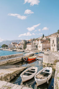 Boats moored at harbor