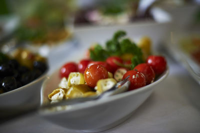 Close-up of strawberries in plate on table