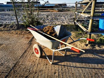 Abandoned shopping cart on sand