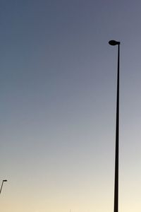 High section of street light against clear sky