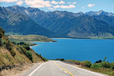 Deserted road down to lake tekapo