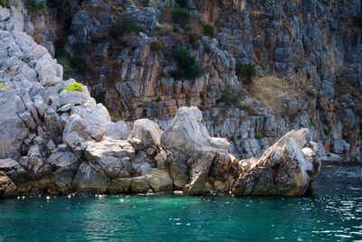 Scenic view of rock formations in sea