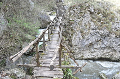 Wooden footbridge over water