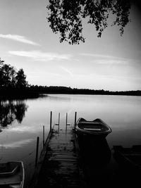 Pier on lake against sky