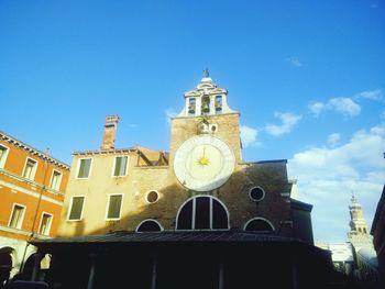 Low angle view of built structure against blue sky