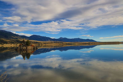 Scenic view of lake against sky during sunset