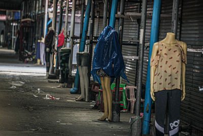 Rear view of woman walking on street in city