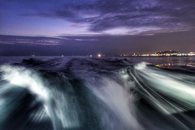 Scenic view of sea against sky at night