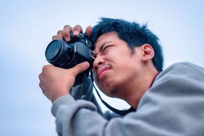 Portrait of man photographing