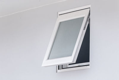 Close-up of window against white wall