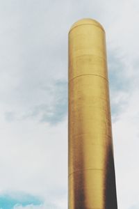 Low angle view of smoke stack against sky