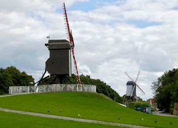 Traditional windmill against sky