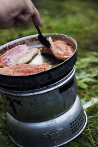 Frying freshly caught fish outdoors