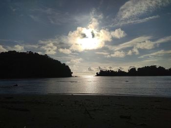 Scenic view of beach against sky during sunset