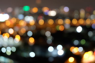 Defocused image of illuminated lights at night