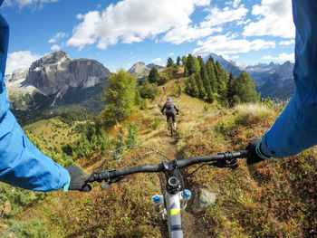 People riding bicycle on mountain road