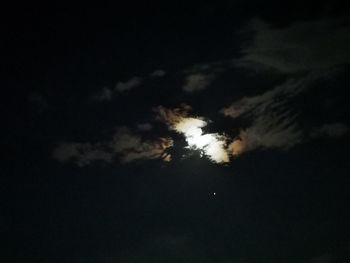 Low angle view of silhouette moon at night