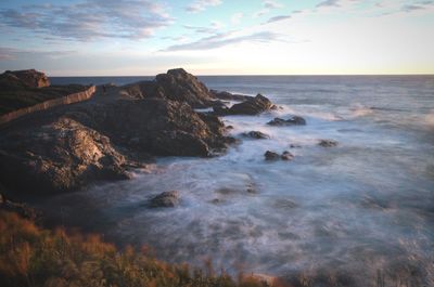 Scenic view of sea against sky at sunset