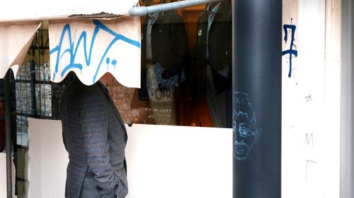 Rear view of man standing by door