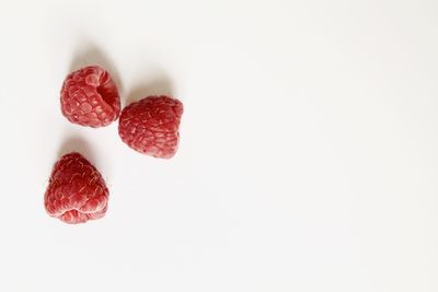 Close-up of strawberry over white background