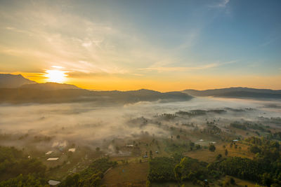 Scenic view of landscape against sky during sunset