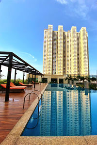 View of swimming pool against buildings