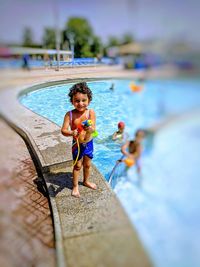 Portrait of boy in swimming pool