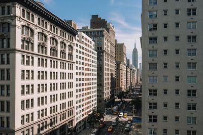 Buildings in city against sky