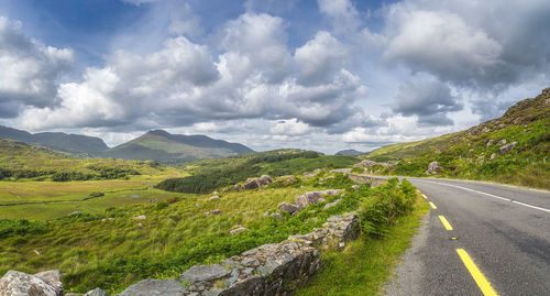 Winding road going through molls gap with owenreagh river valley, ring of kerry ireland