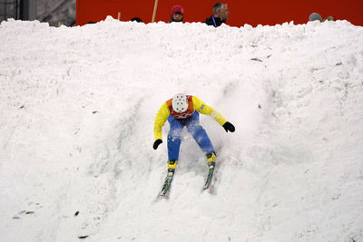 Full length of man skiing on snow