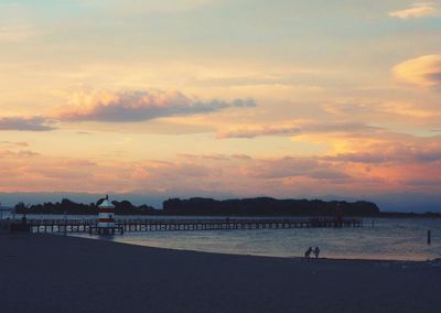 Scenic view of beach against sky during sunset