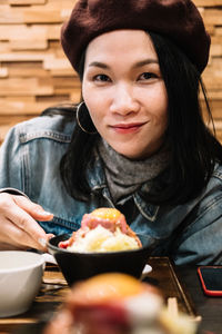 Portrait of woman holding ice cream