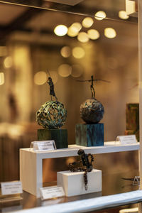 Close-up of illuminated lamp on table at store