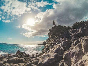 Scenic view of sea against cloudy sky