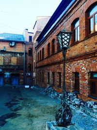 Street amidst buildings in city against sky