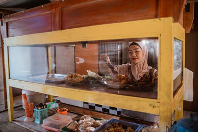 High angle view of woman standing in store