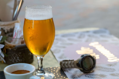 A glass of beer on the table