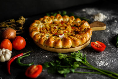 Baked meal with ingredients on table