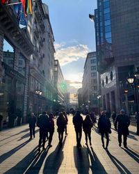 Group of people walking on city street