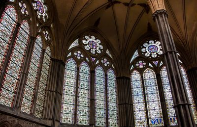 Low angle view of glass window in temple