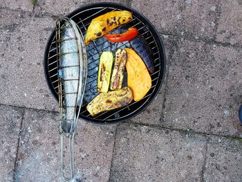 High angle view of fish on barbecue grill