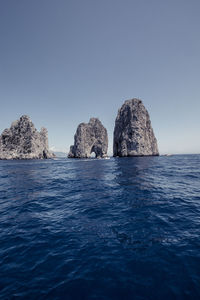 Scenic view of sea against clear blue sky