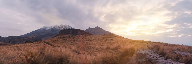 Scenic view of mountains against sky during sunset