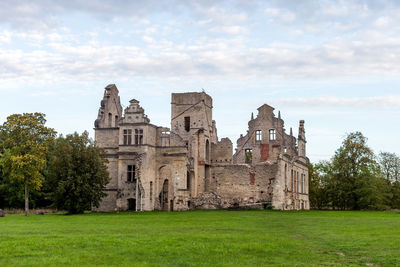 Historic building against cloudy sky