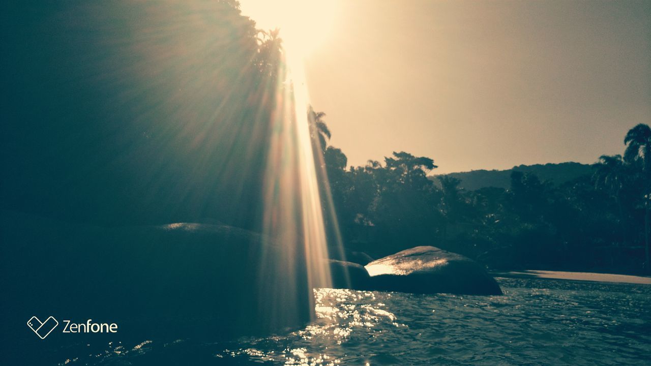 SCENIC VIEW OF SEA AGAINST BRIGHT SUN