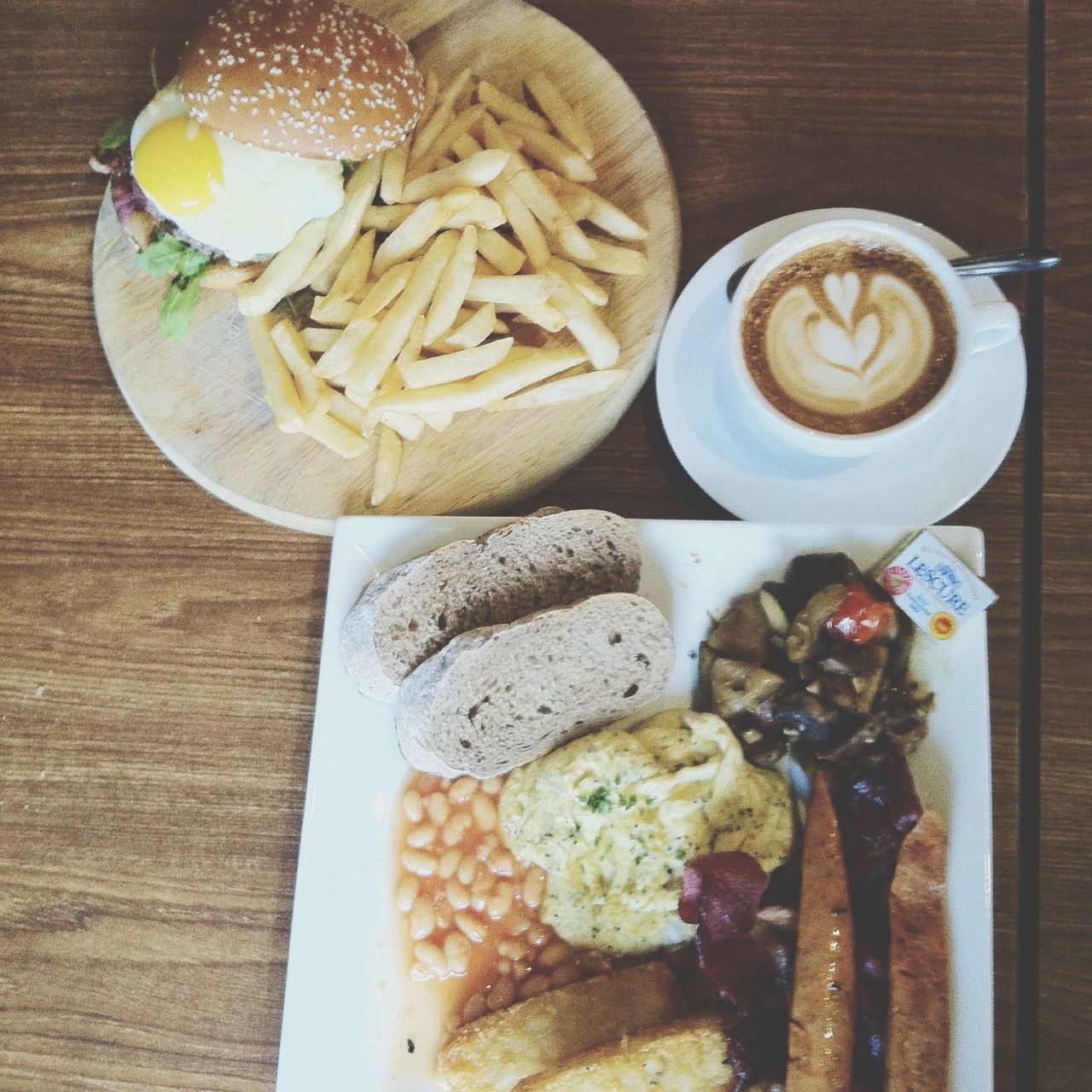 food and drink, food, freshness, indoors, ready-to-eat, table, still life, plate, high angle view, indulgence, healthy eating, serving size, bread, meal, breakfast, refreshment, meat, close-up, drink