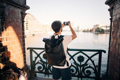 Man photographing at camera