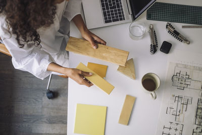 High angle view of woman working on table