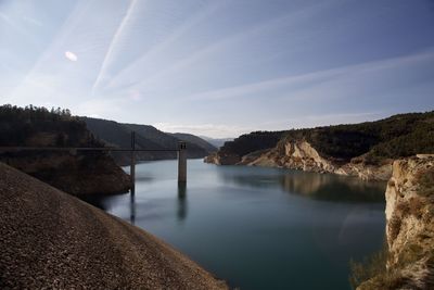 Bridge over river against sky